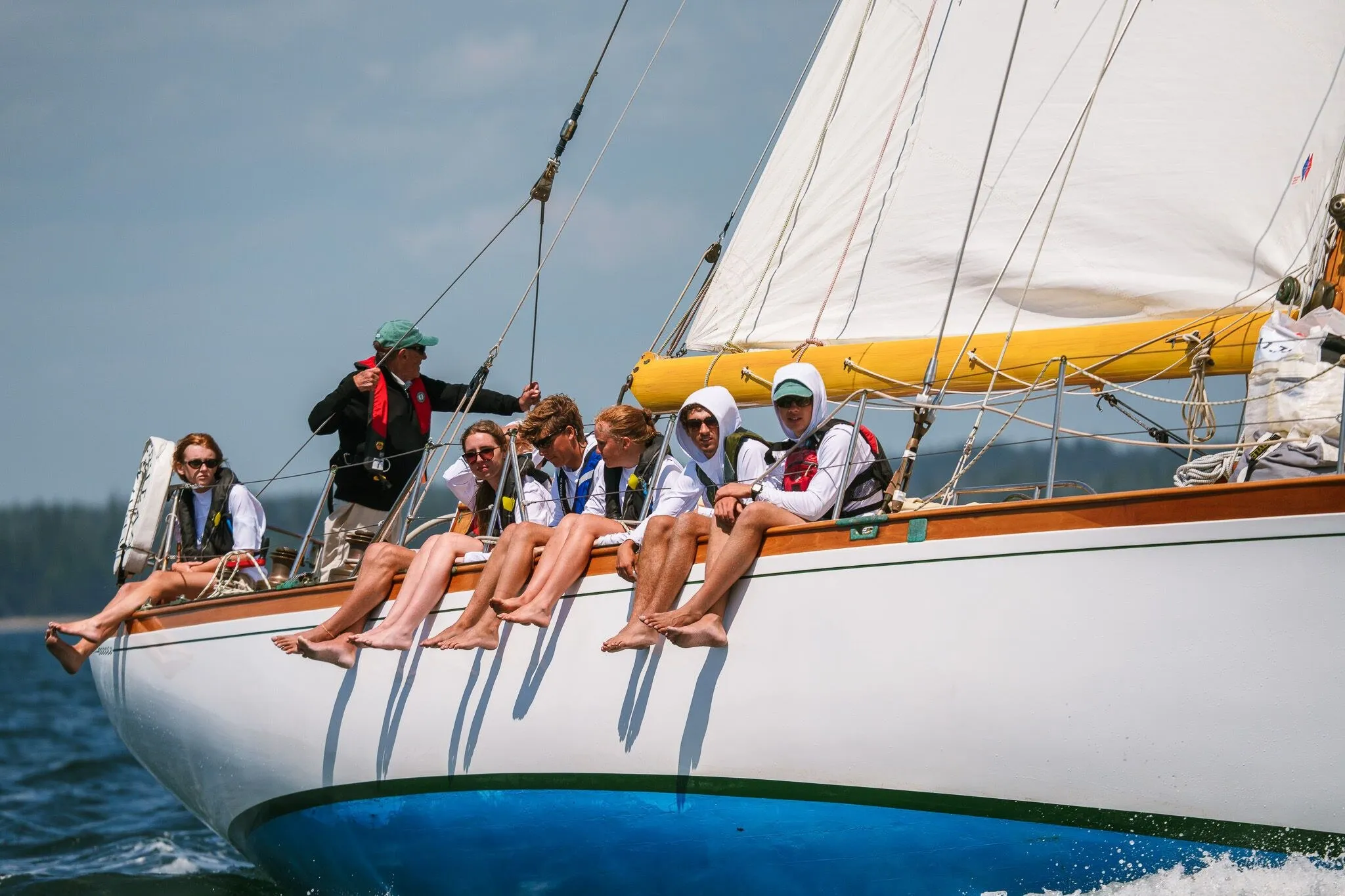 Crew hiking out on the rail of a classic yacht, Eggemoggin Reach, ME