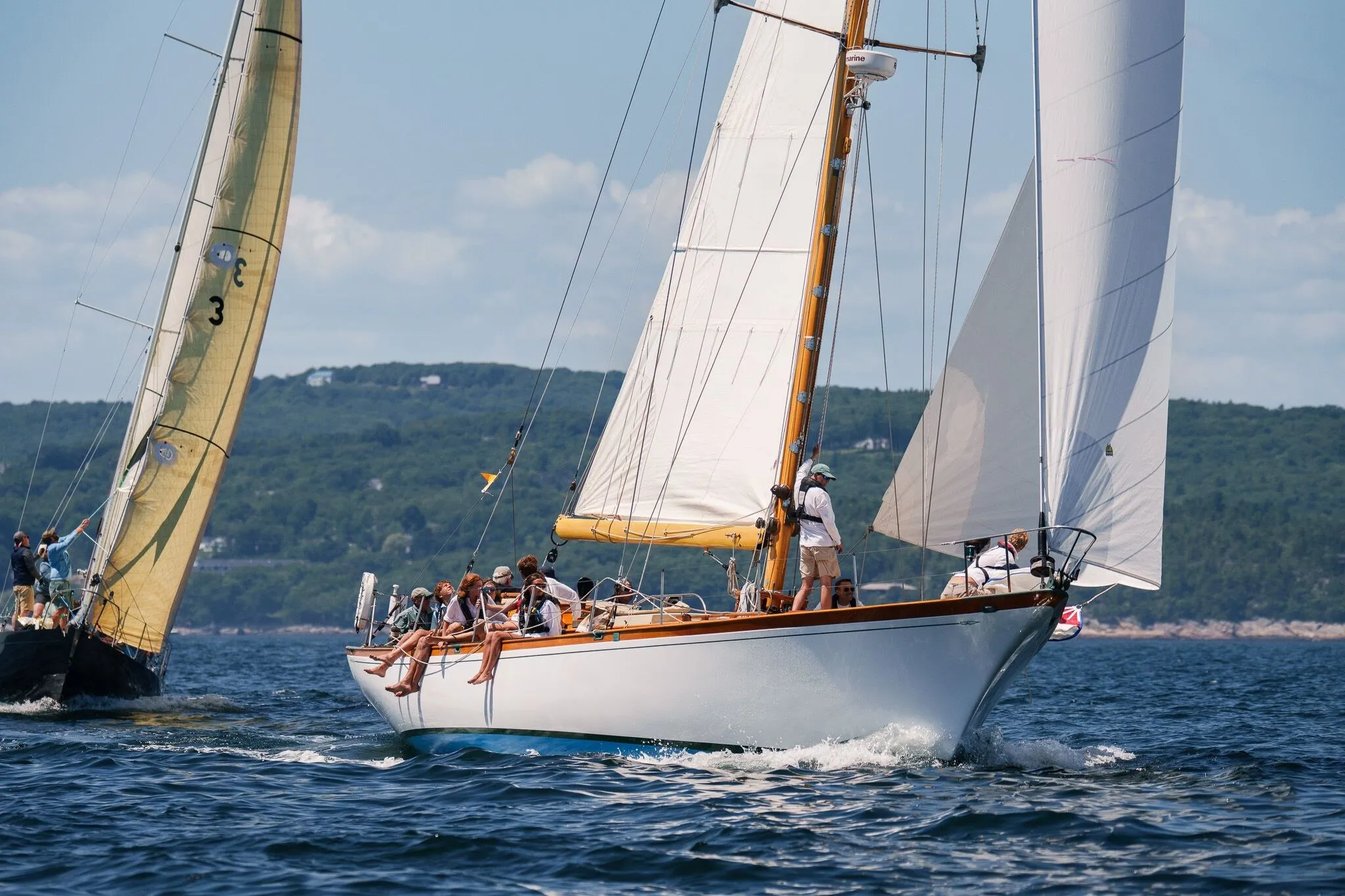 Two classic yachts racing downwind under a yellow spinnaker, Penobscot Bay, ME